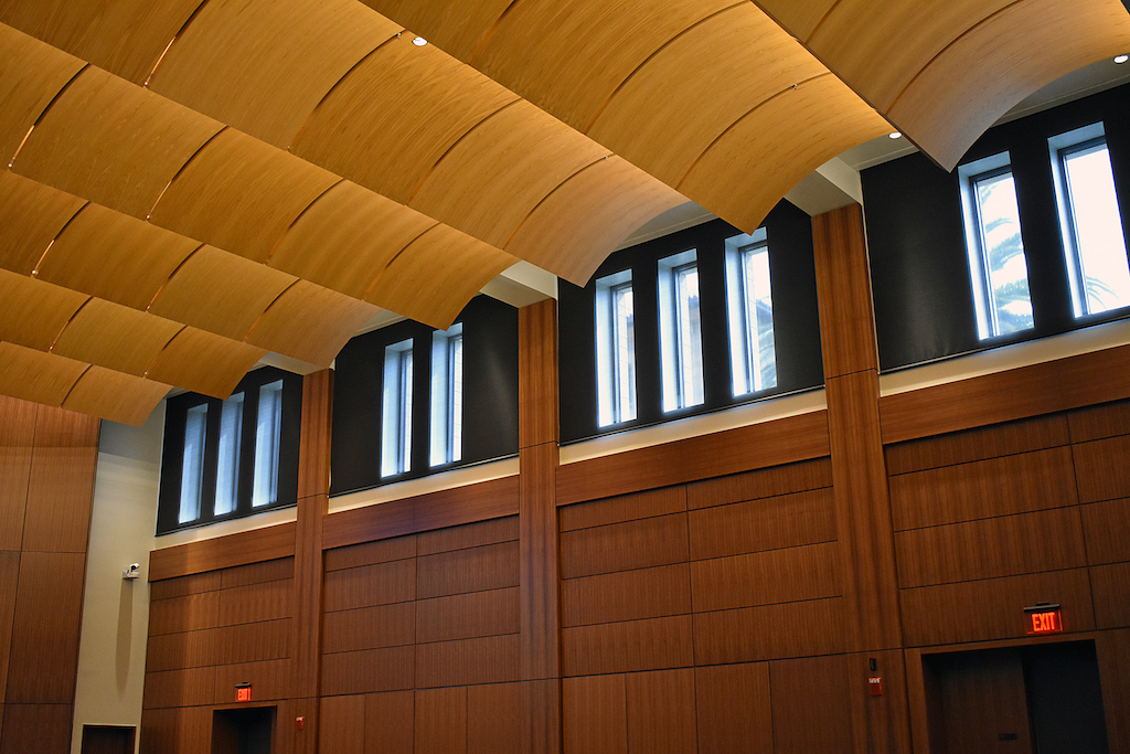 Image of room with wood paneled walls, columns and ceiling.